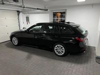 Gebraucht BMW 320e 190 PS (139 kW) 2021 Schwarz Kombi