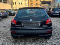 Gebraucht Peugeot 206+ 75 PS (55 kW) 2010 Schwarz Kleinwagen