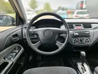 Second-hand Mitsubishi Lancer 100 CP (73 kW) 2004 Negru Break