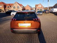 Gebraucht Peugeot e-2008 Active 100 kW (136 PS) 2022 Met.orange fusion SUV