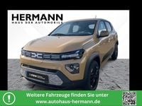 Gebraucht Dacia Spring Extreme 47 kW (65 PS) 2024 Safaribeige (beige) Kleinwagen