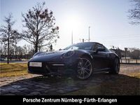 Gebraucht Porsche 992 385 PS (283 kW) 2023 Tiefschwarzmetallic Coupé