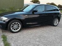 Gebraucht BMW 116 122 PS (89 kW) 2010 Schwarz Kleinwagen