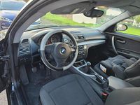 Gebraucht BMW 116 122 PS (89 kW) 2009 Schwarz Kleinwagen