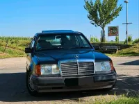 Używany Mercedes E230 132 KM (97 kW) 1990 Purpurowy Sedan/Limuzyna