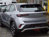Gebraucht Opel Mokka-e Elegance 100 kW (136 PS) 2022 Kontrast grauquarz silber (metallic) SUV