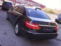 Second-hand Mercedes E200 184 CP (135 kW) 2011 Negru Berlinǎ