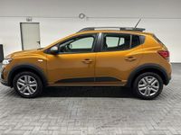 Gebraucht Dacia Sandero Expression 91 PS (66 kW) 2023 Orange (taklamakanorange met.) Kleinwagen
