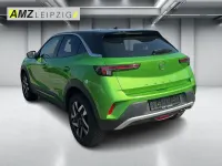 Gebraucht Opel Mokka Elegance 131 PS (96 kW) 2023 Matcha green/ikone gruen SUV