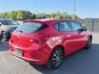 Używany Opel Astra Selection 116 KM (85 kW) 2015 Czerwony Sedan/Limuzyna