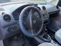 Second-hand VW Caddy 109 CP (80 kW) 2009 Argintiu Monovolum