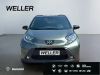 Gebraucht Toyota Aygo Pulse 72 PS (52 kW) 2023 Cardamon green / black mica (gruen) Kleinwagen