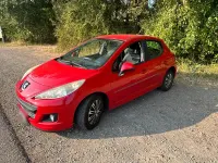Gebraucht Peugeot 207 95 PS (69 kW) 2011 Rot Kleinwagen
