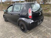 Gebraucht Daihatsu Sirion 91 PS (66 kW) 2011 Schwarz Kleinwagen