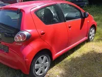 Gebraucht Toyota Aygo 68 PS (50 kW) 2009 Rot Kleinwagen