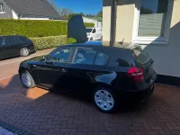 Gebraucht BMW 116 122 PS (89 kW) 2010 Schwarz Kleinwagen