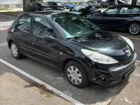 Gebraucht Peugeot 206 73 PS (53 kW) 2011 Schwarz Kleinwagen