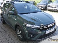 Gebraucht Dacia Sandero Expression 91 PS (66 kW) 2024 Safarigrüngrau metallic Kleinwagen