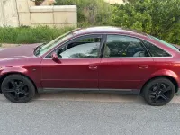 Używany Audi A6 150 KM (110 kW) 1999 Czerwony Sedan/Limuzyna