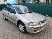 Second-hand Mazda 323 88 CP (64 kW) 1996 Auriu Berlinǎ