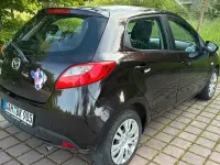 Używany Mazda 2 Dynamic 103 KM (75 kW) 2009 Purpurowy Hatchback