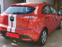 Używany Kia Rio 85 KM (62 kW) 2013 Czerwony Hatchback