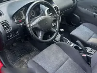 Begagnad Mitsubishi Carisma 103 HK (75 kW) 2004 Svart Sedan