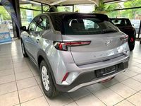 Gebraucht Opel Mokka-e Edition 100 kW (136 PS) 2023 Kontrast grau/quarz silber SUV
