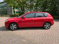 Używany Mazda 3 105 KM (77 kW) 2006 Czerwony Sedan/Limuzyna