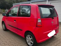 Gebraucht Daihatsu Cuore 58 PS (42 kW) 2005 Rot Kleinwagen
