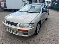 Second-hand Mazda 323 88 CP (64 kW) 1996 Auriu Berlinǎ