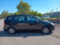 Używany Kia Carens Basis 144 KM (105 kW) 2009 Czarny Minivan