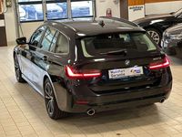 Gebraucht BMW 320e Performance 163 PS (119 kW) 2021 Saphirschwarz Kombi