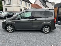 Gebraucht Ford Tourneo Courier Titanium 101 PS (74 kW) 2015 Magneticgrau (metallic) Van / Kleinbus