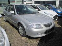 Używany Mazda 323 Comfort 72 KM (52 kW) 2001 Srebrny Sedan/Limuzyna