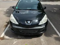 Gebraucht Peugeot 206 73 PS (53 kW) 2011 Schwarz Kleinwagen