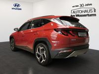 Gebraucht Hyundai Tucson Basis 265 PS (194 kW) 2023 Sunset red / mic (rot) SUV