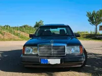 Używany Mercedes E230 132 KM (97 kW) 1990 Purpurowy Sedan/Limuzyna