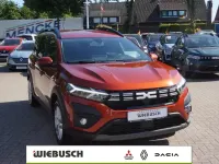 Gebraucht Dacia Jogger Expression 141 PS (103 kW) 2023 Braun Van / Kleinbus