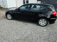 Gebraucht BMW 116 122 PS (89 kW) 2008 Schwarz Kleinwagen