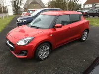 Gebraucht Suzuki Swift Comfort 83 PS (61 kW) 2023 Burning red pearl metallic Kleinwagen