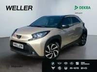 Gebraucht Toyota Aygo 72 PS (52 kW) 2023 Ginger beige / black mica Kleinwagen