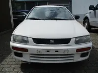 Używany Mazda 323 88 KM (64 kW) 1996 Biały Sedan/Limuzyna