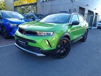 Gebraucht Opel Mokka 131 PS (96 kW) 2023 Lackierung matcha green/typ au SUV