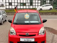 Gebraucht Daihatsu Cuore 69 PS (50 kW) 2010 Rot Kleinwagen