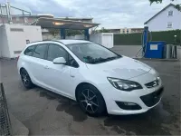 Używany Opel Astra 110 KM (80 kW) 2013 Biały Kombi