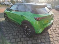 Gebraucht Opel Mokka 131 PS (96 kW) 2024 Lackierung matcha green/typ aussenverkleidung metalliclackierung SUV