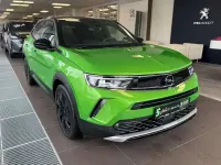 Gebraucht Opel Mokka Ultimate 131 PS (96 kW) 2023 Lackierung matcha green/typ au SUV