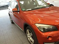 Second-hand BMW X1 143 CP (105 kW) 2013 Portocaliu SUV
