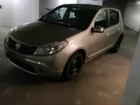 Używany Dacia Sandero 90 KM (66 kW) 2011 Beżowy Sedan/Limuzyna